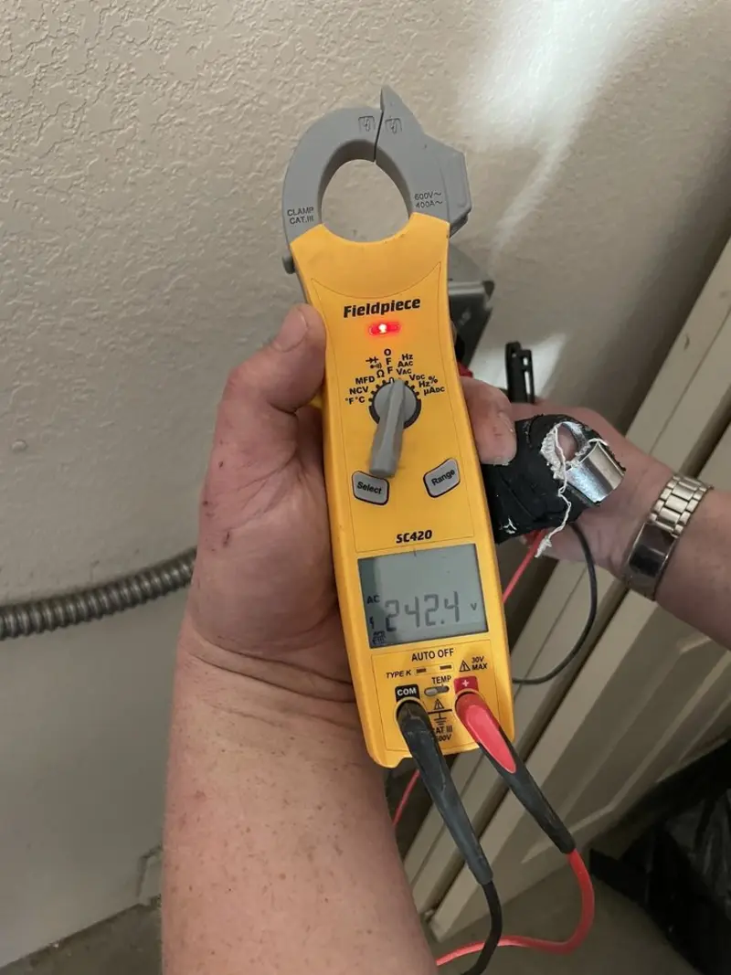 Voltage testing with clamp meter during Recessed Lighting Installation in Peoria